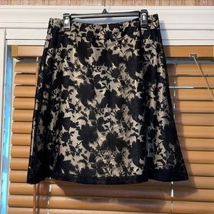 Black skirt with cream opaque slip